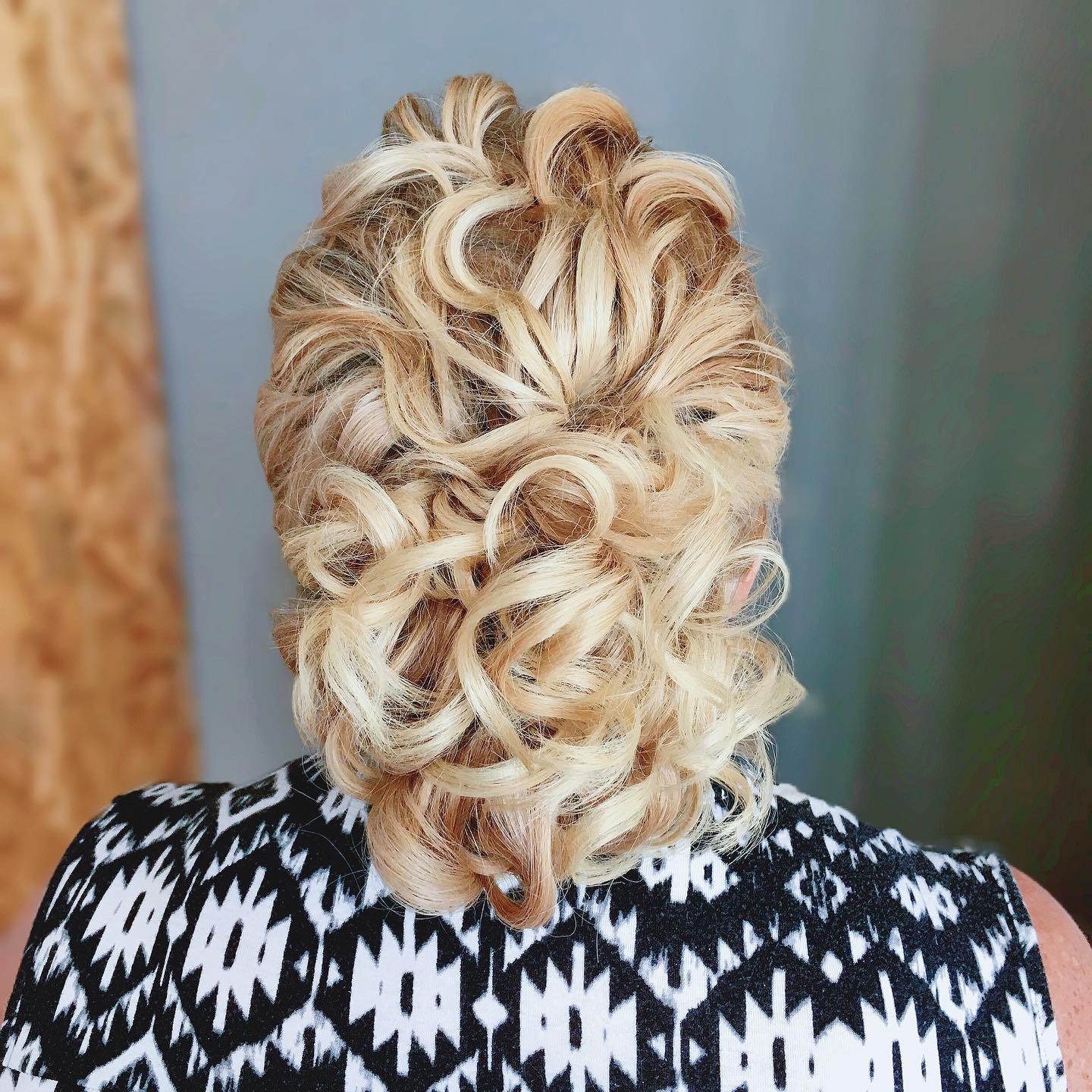 Low Blonde Updo with Defined Curls